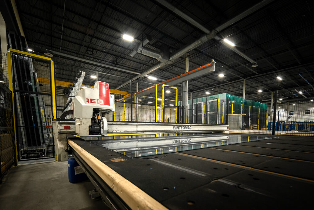 Glass fabrication line with automated machinery