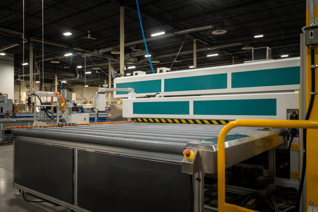 Tempering oven in action with reflective panels