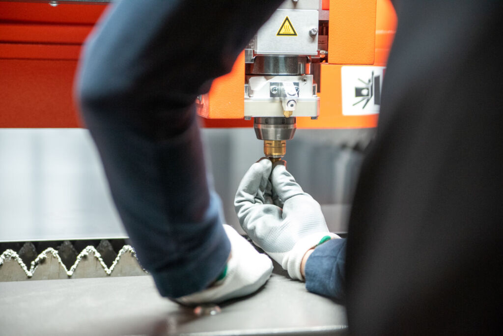 Worker operating CNC machine in motion blur