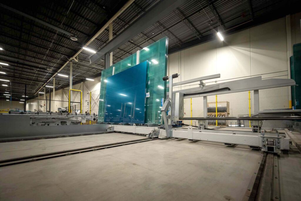Large glass panels being moved by suction lift system