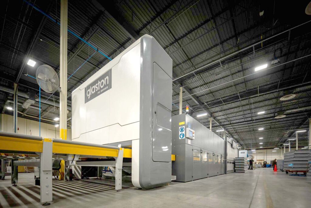 Tempering oven exterior labeled 'North Glass' in factory