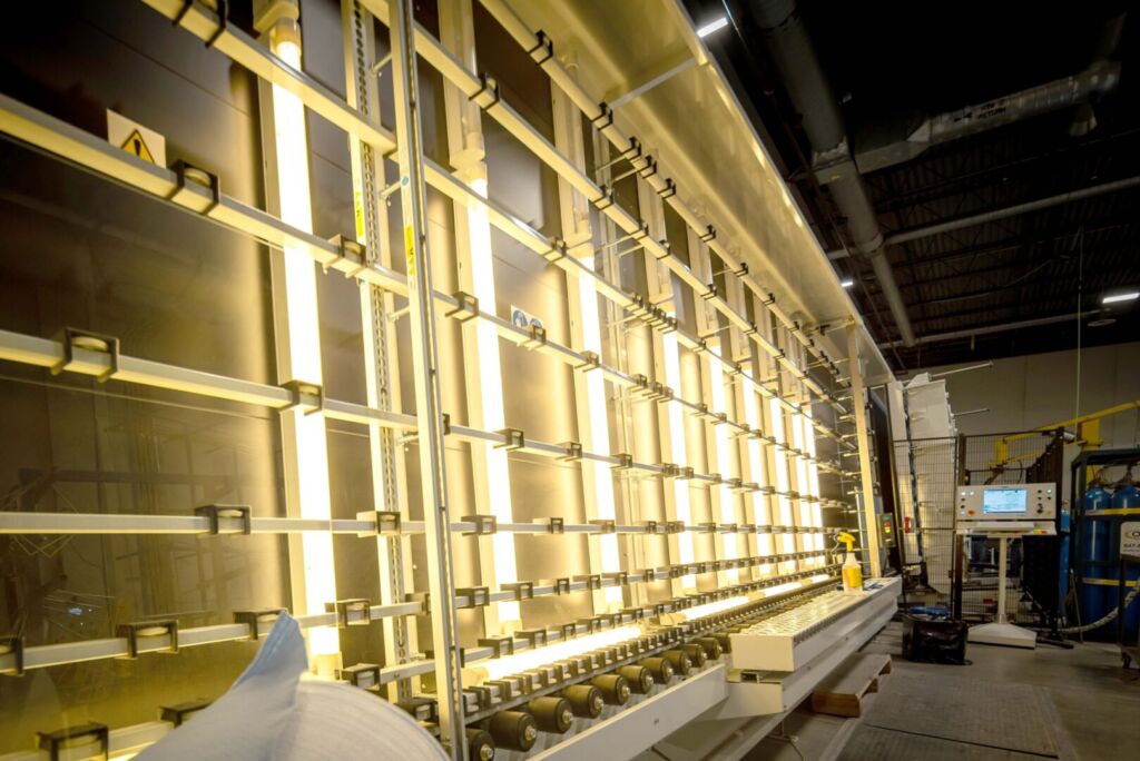 Bright yellow glass processing station with alignment grid