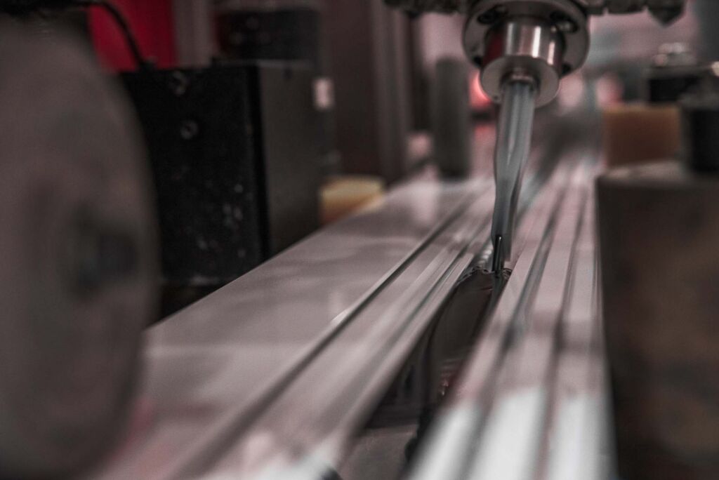 Extruded aluminum sliding through alignment and guide rollers